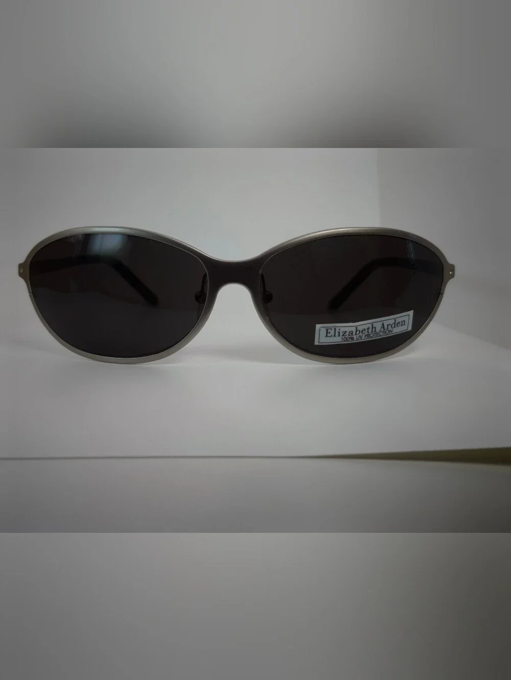 Elizabeth Arden Oval Wrap Sunglasses with Dark Lenses and Silver Frame